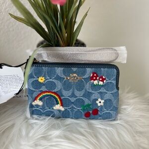 Coach denim embroidered wristlet